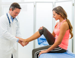 Doctor examining an ankle