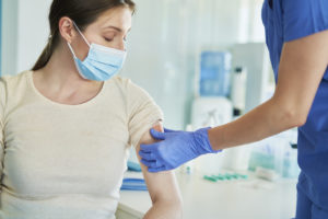 A woman being treated for a minor injury at her local urgent care clinic.